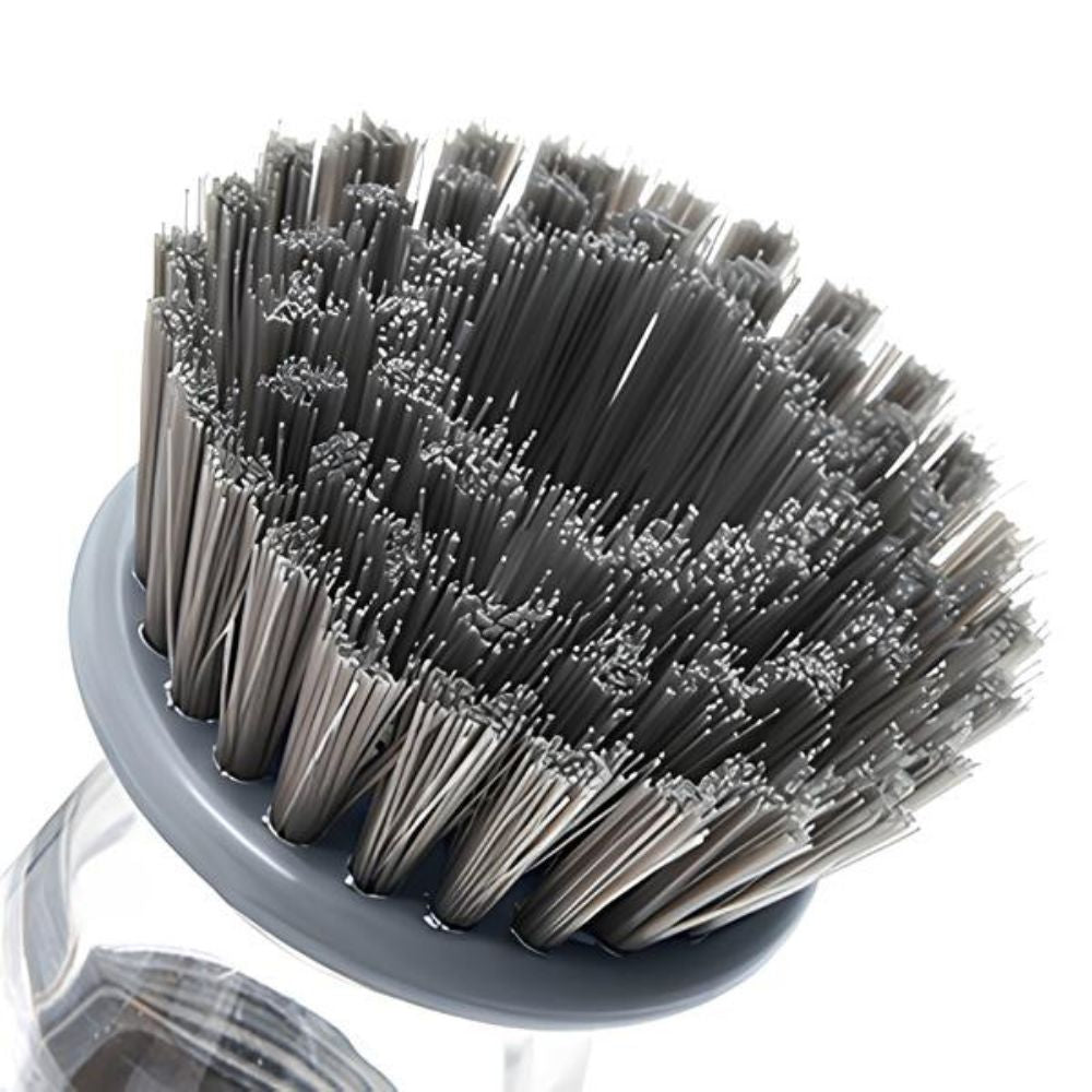 Brosse à vaisselle avec réservoir de produit